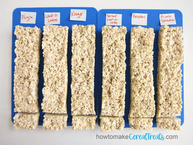 Six rows of rice krispie treats made using 6 different brands of butter including Plugra, Land-O-Lakes (salted and unsalted), Kroger, Private Selection French Style Butter, and President Butter to find the very best tasting rice krispie treats. 
