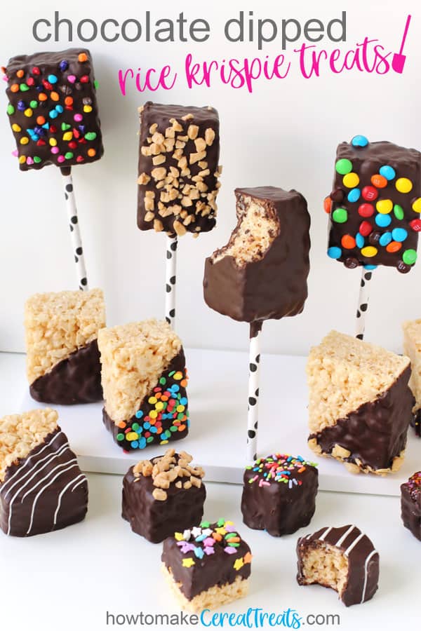 a variety of chocolate dipped rice krispie treats including lollipops, bars, and bites, some are plain and some are topped with sprinkles, candies, nuts, and more