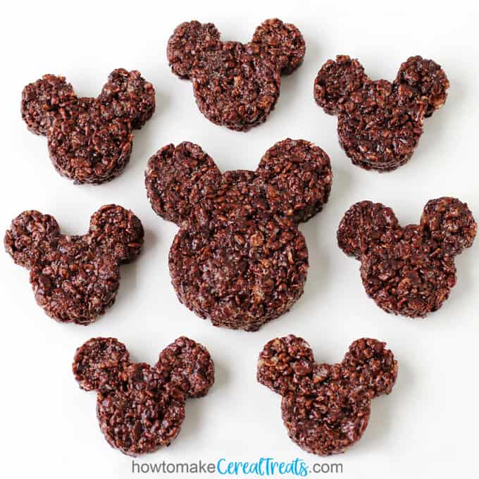 one large chocolate Mickey Mouse Rice Krispie Treat surrounded by six smaller treats