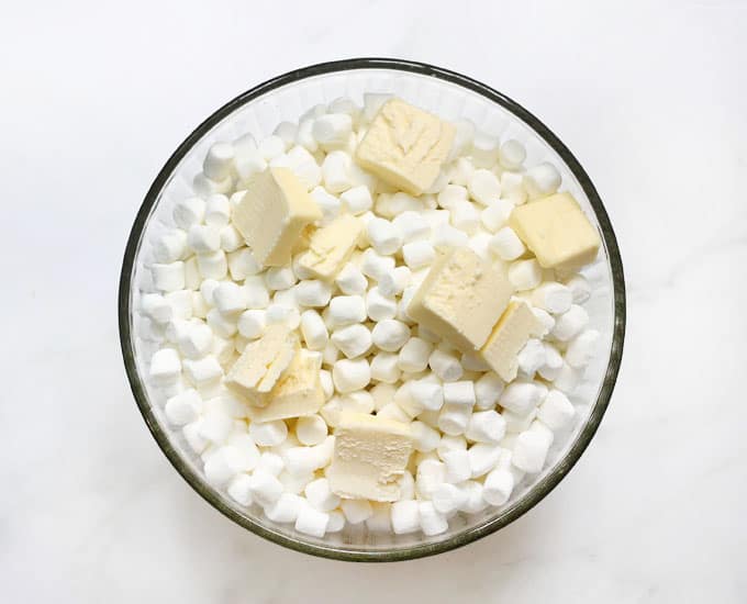 marshmallows and butter in bowl to make cocoa krispies treats 