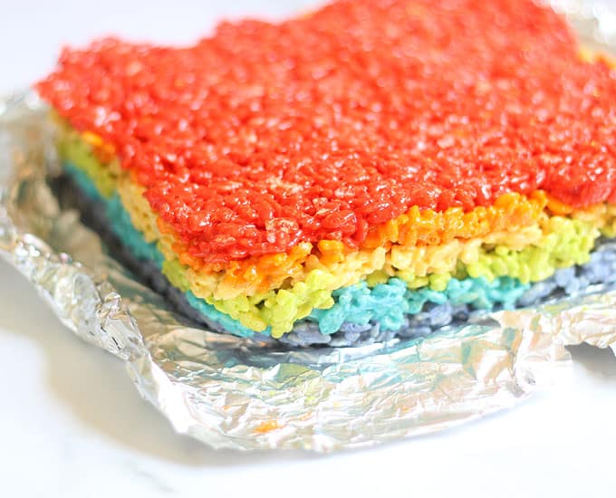 layers of rainbow rice krispie treats out of baking pan