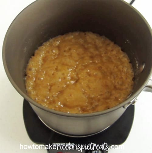 Boil the caramel for 5-6 minutes until it reaches 240-250 degrees Fahrenheit to make caramel rice krispie treats.