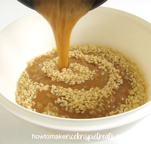 Pouring caramel over Rice Krispies Cereal to make caramel crispy treats. 