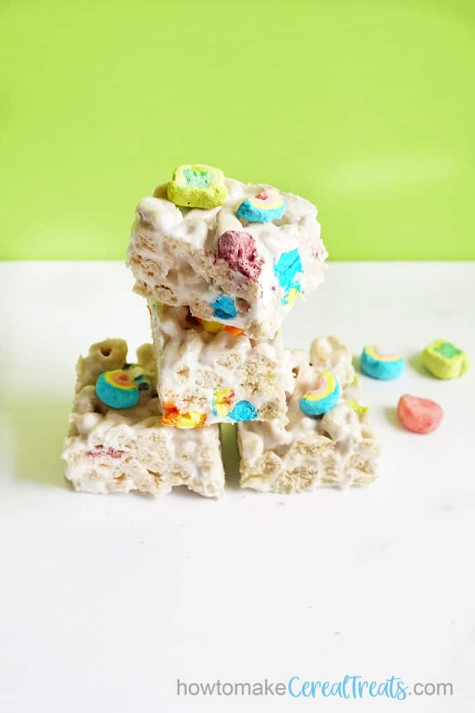 stacked lucky charms treats with green background 