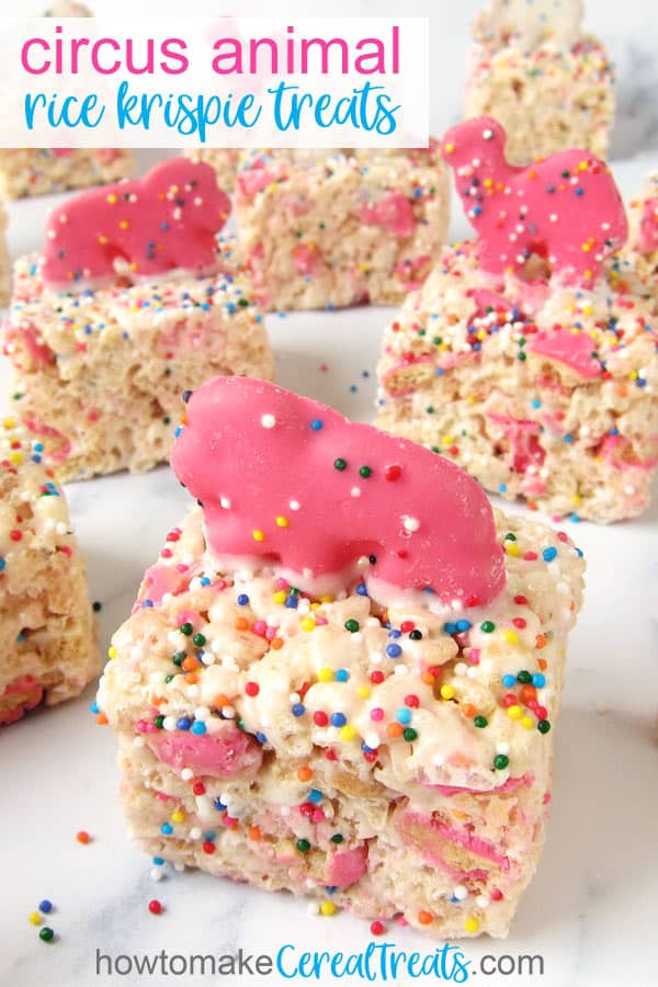 Circus Animal Rice Krispie Treats topped with rainbow sprinkles and pink and white animal-shaped cookies.