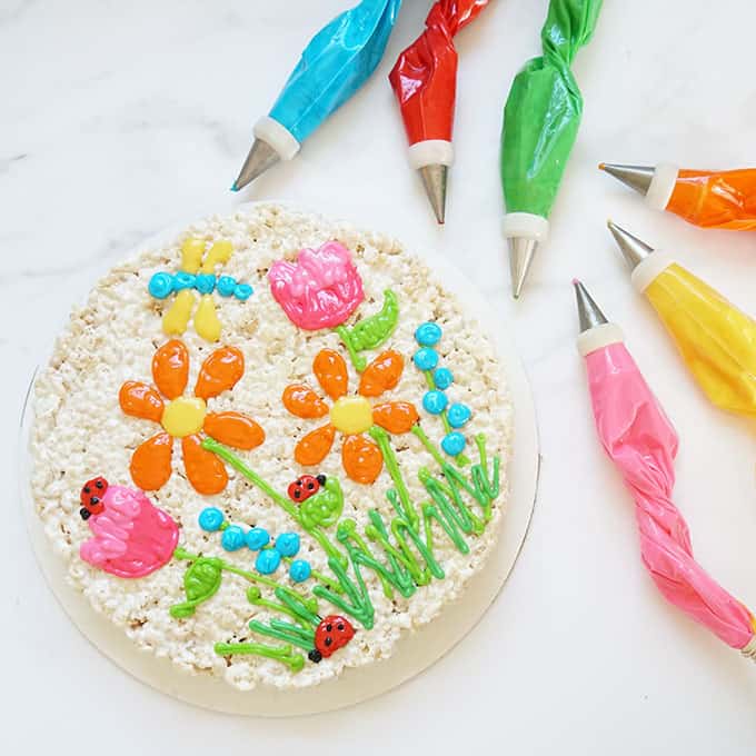 spring rice krispie treat cake with bags of royal icing