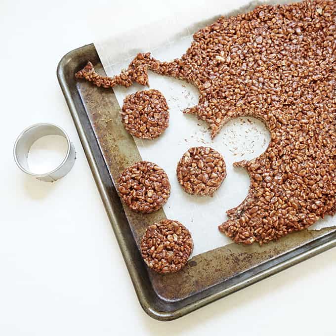 chocolate rice krispie treat circles on baking tray