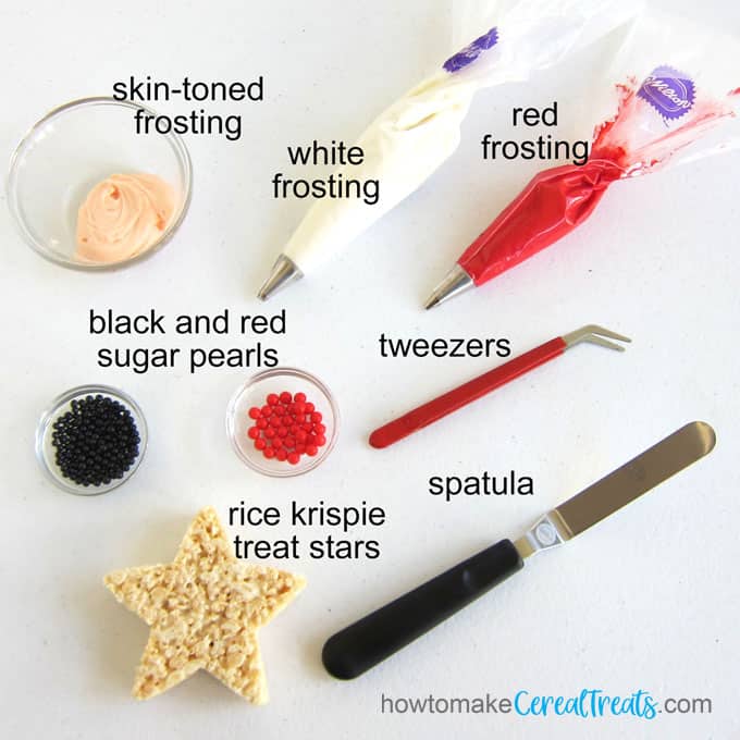 to decorate the Santa treats you will need skin-toned, white, and red frosting along with black and red sugar pearls, a rice krispie treat star, tweezers, and a spatula