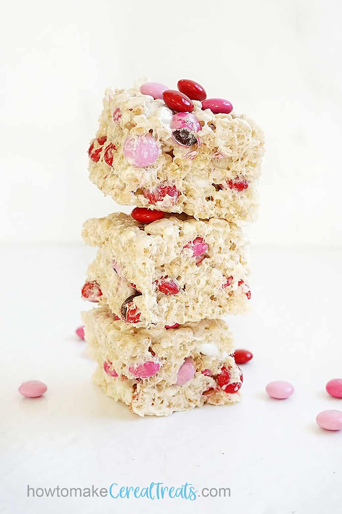 stack of Valentine's Day Rice Krispie Treats with red and pink M&M candy