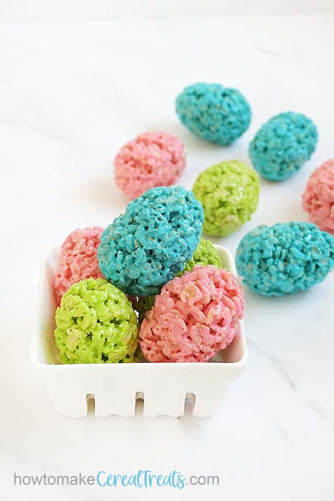 Pink, green, and blue Easter egg Rice Krispie treats shaped with plastic eggs