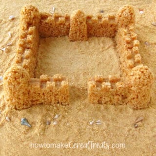 Rice Crispy Treat Sandcastle on a beach of crushed Rice Krispies Cereal