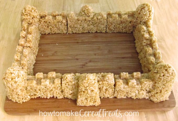Arrange the rice crispy treat castle walls on a cutting board or serving platter.