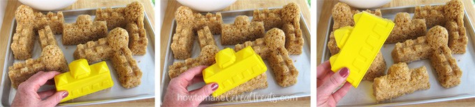 Shake the sandcastle sand mold to remove the Rice Krispie Treat castle pieces.