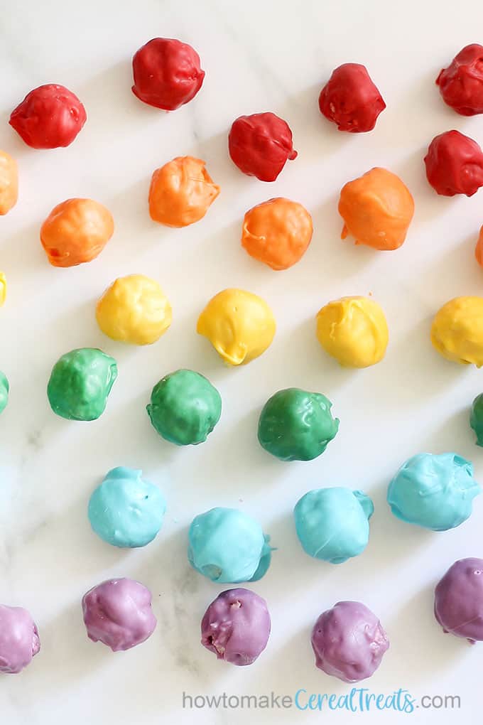 rows of rainbow-colored Rice Krispie treat bites with candy melts
