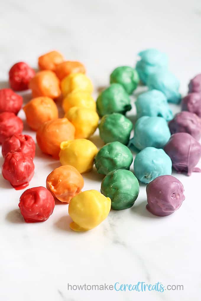 rainbow Rice Krispie treat balls dipped in chocolate 