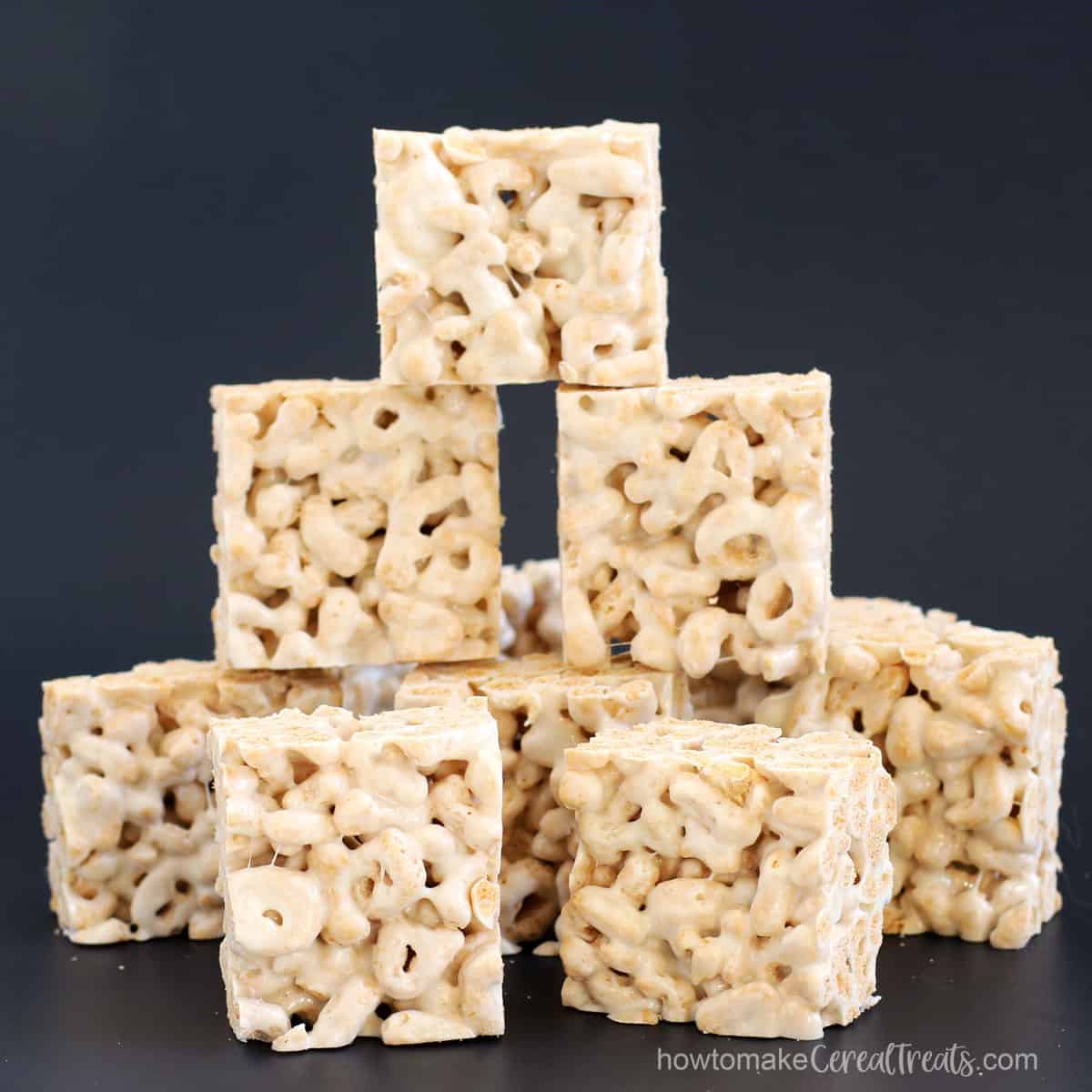 Marshmallow crispy treats made using Alpha-Bits Cereal.