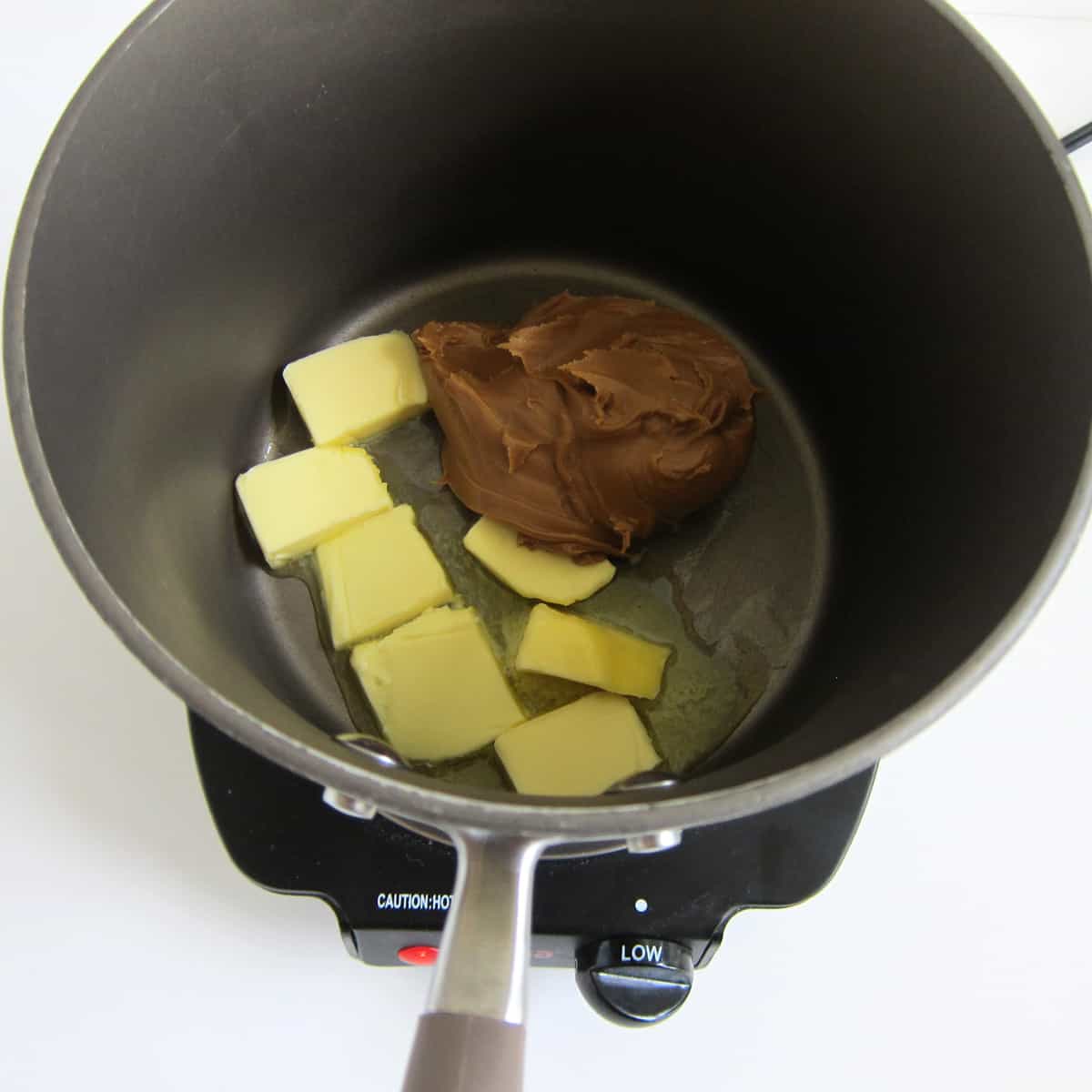 Melt butter and Biscoff Cookie Butter in a medium saucepan.