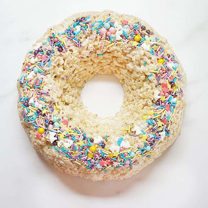 Rice Krispie Bundt Cake topped with sprinkles. 