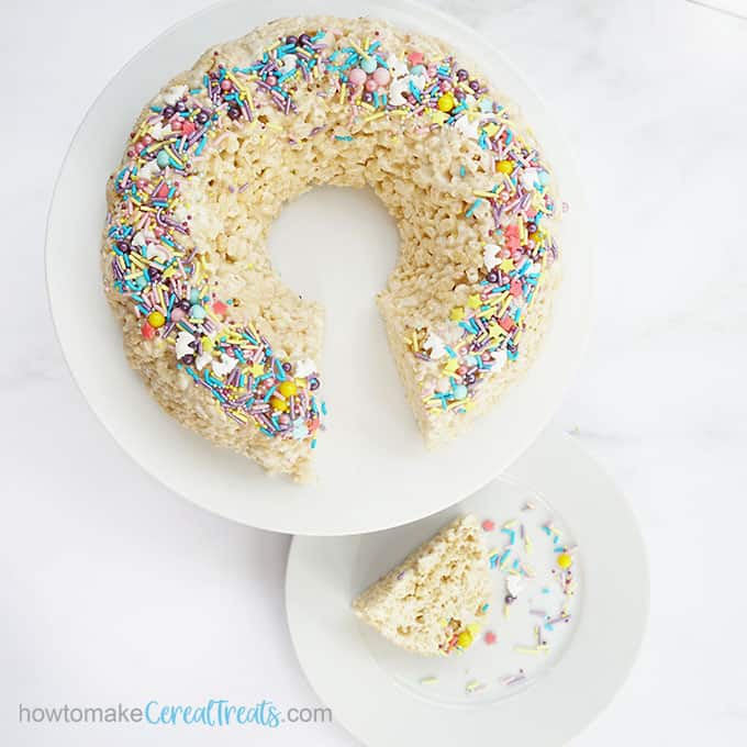 3-ingredient Rice Krispie Bundt Cake topped with rainbow unicorn sprinkles 