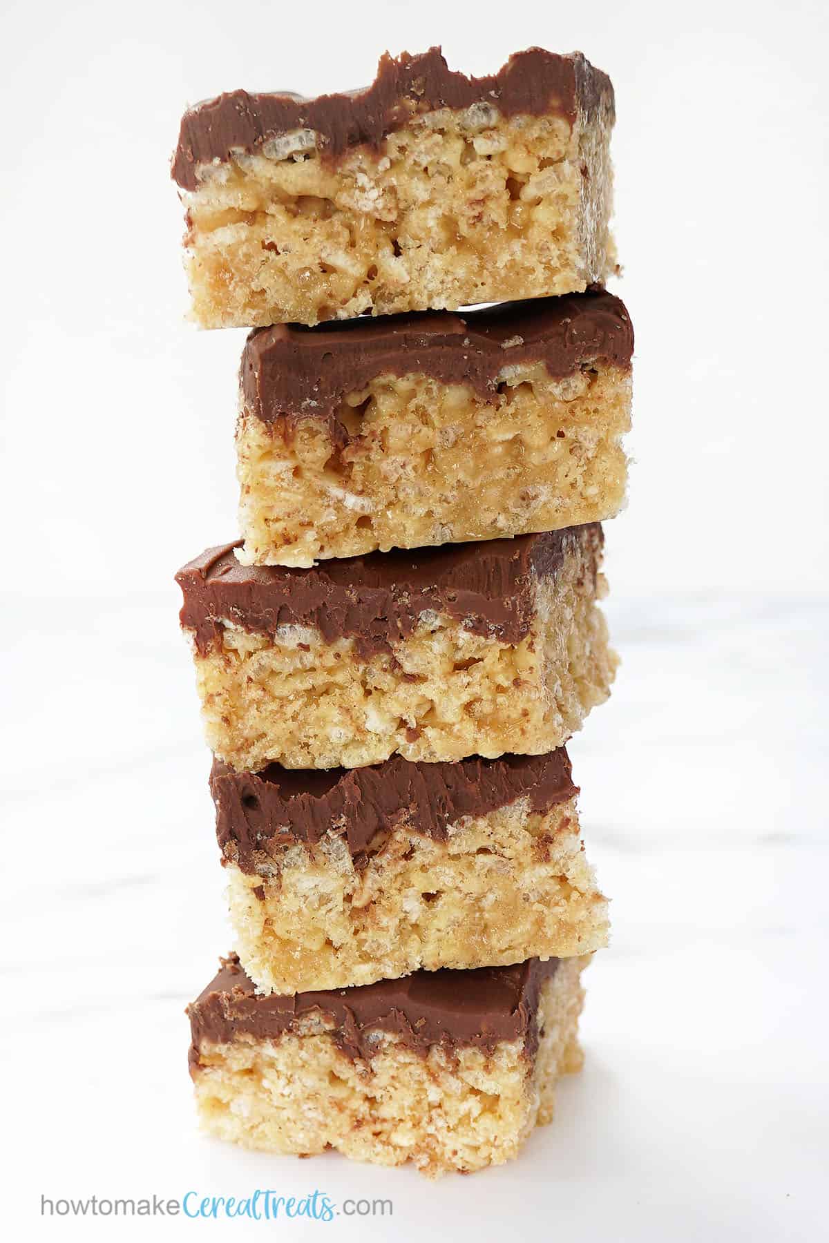 stack of peanut butter treats with chocolate and butterscotch topping 