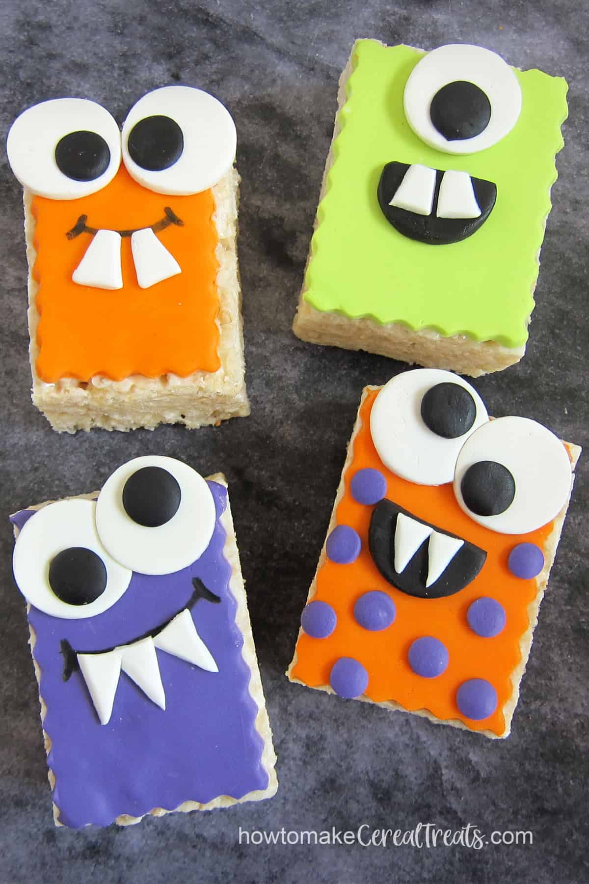 Rice Krispie Treat Monsters decorated with colorful modeling chocolate.