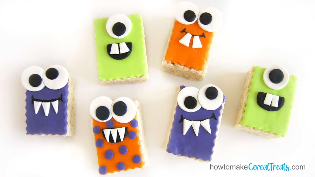 Halloween Rice Krispie Treat Monsters decorated with brightly colored candy clay.