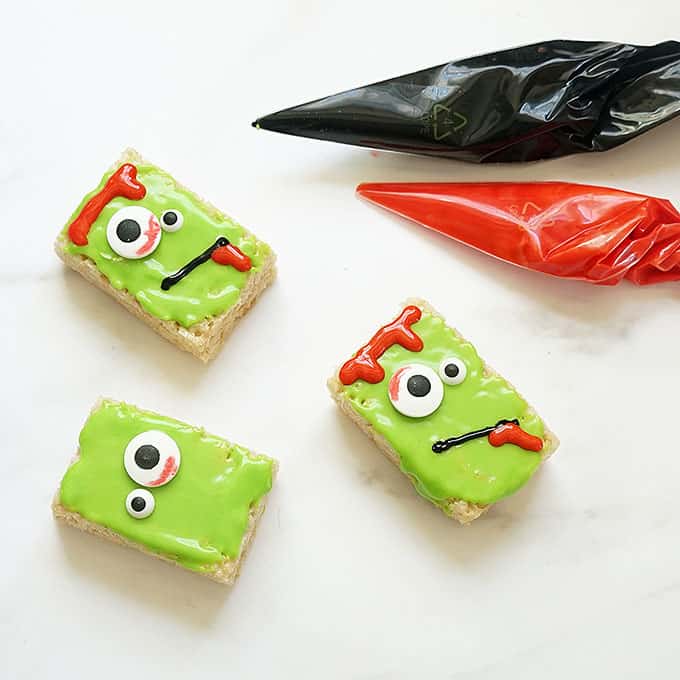 decorating Zombie Rice Krispie Treats with icing 