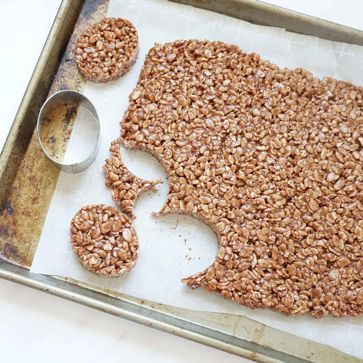 cutting out oval chocolate Rice Krispie Treats
