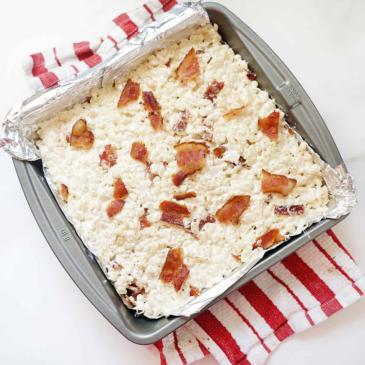 maple syrup and bacon Rice Crispy Treats in baking pan