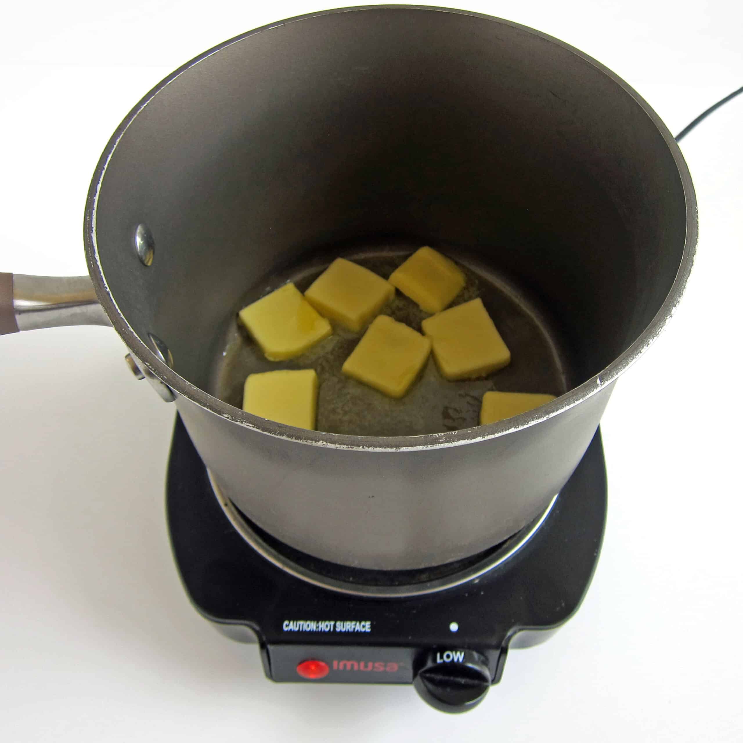 melting butter in saucepan over low heat