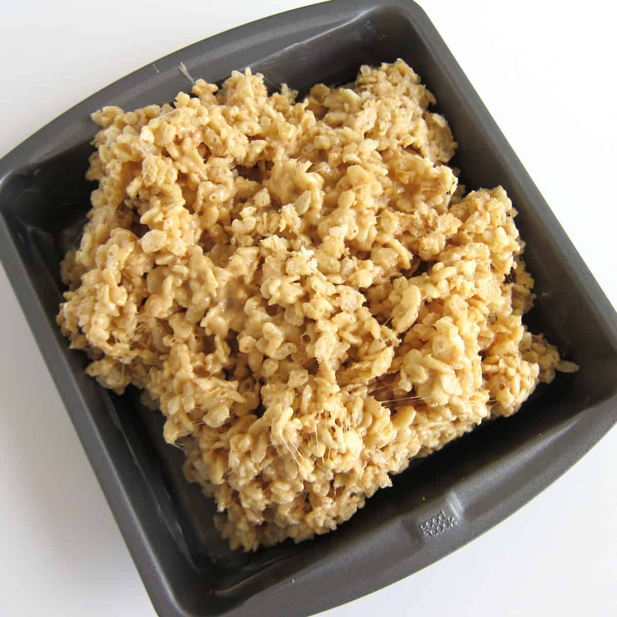 cashew butter rice krispie treat mixture in baking pan
