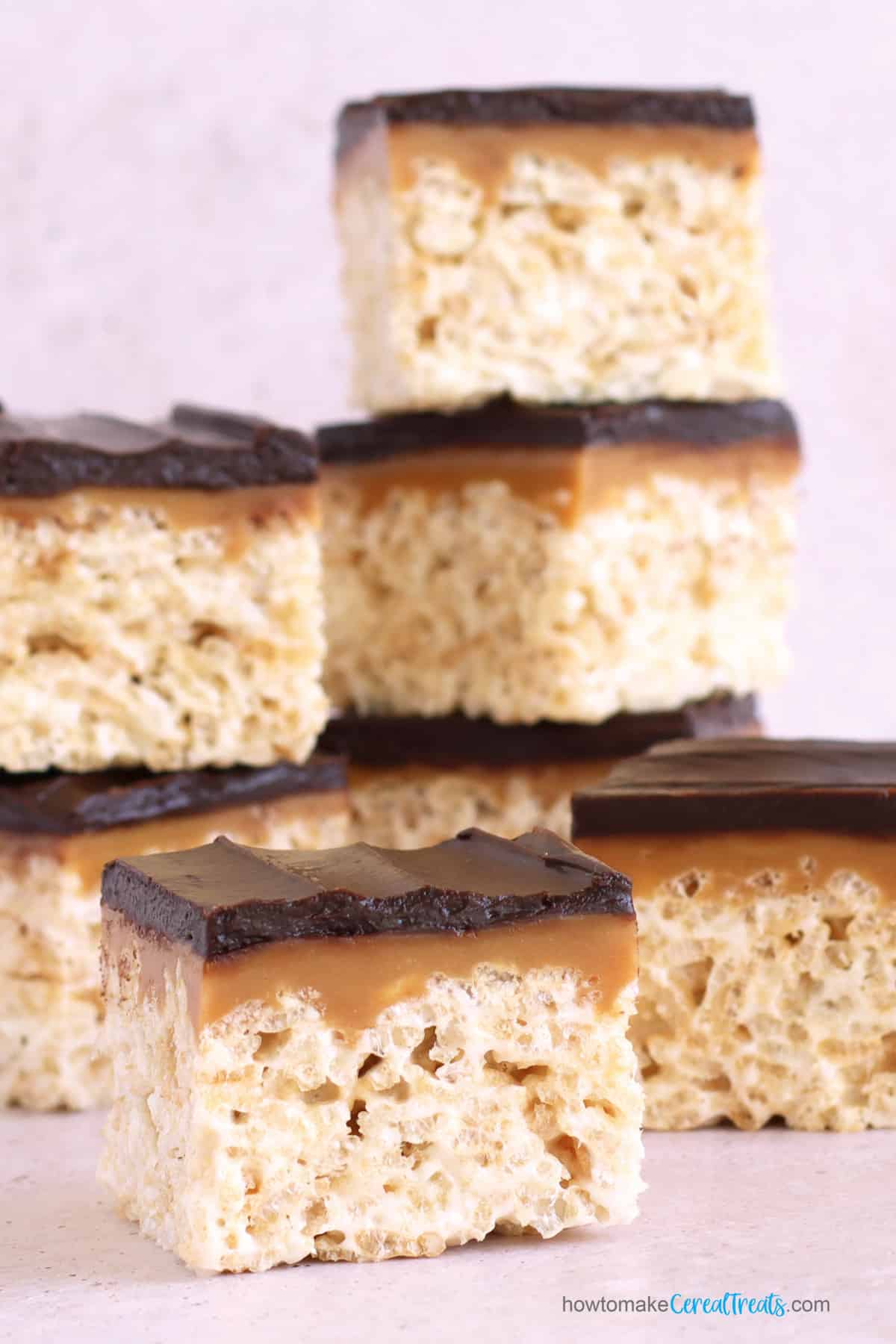 rice krispie treats topped with caramel and chocolate