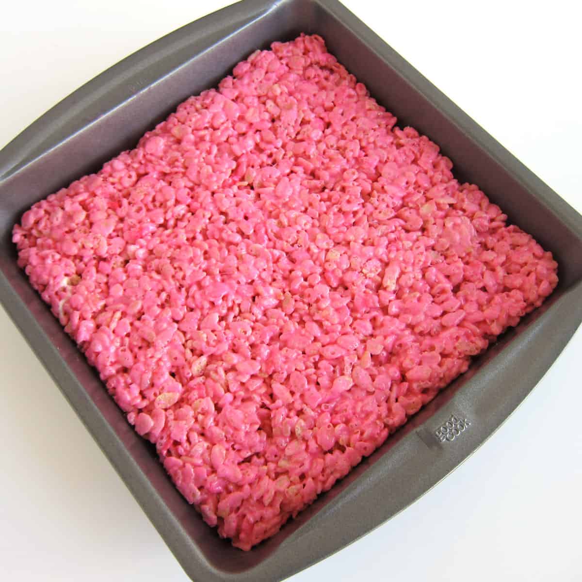 bright pink rice crispy treats in a pan