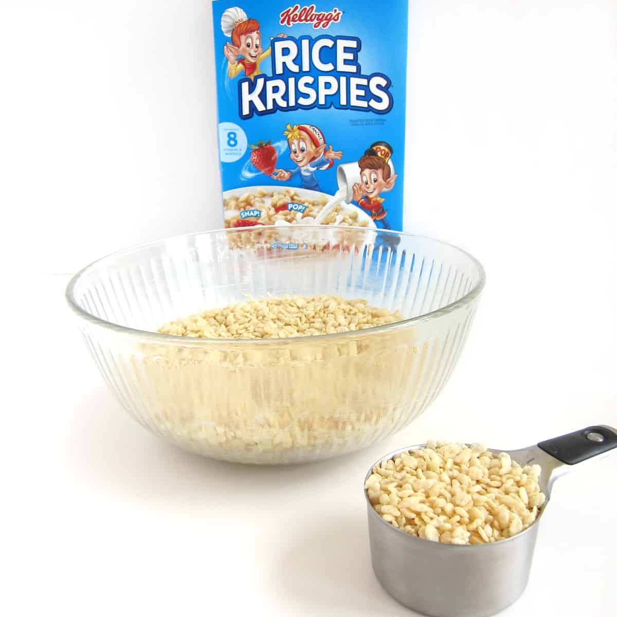 Rice Krispies Cereal in a box, bowl, and measuring cup