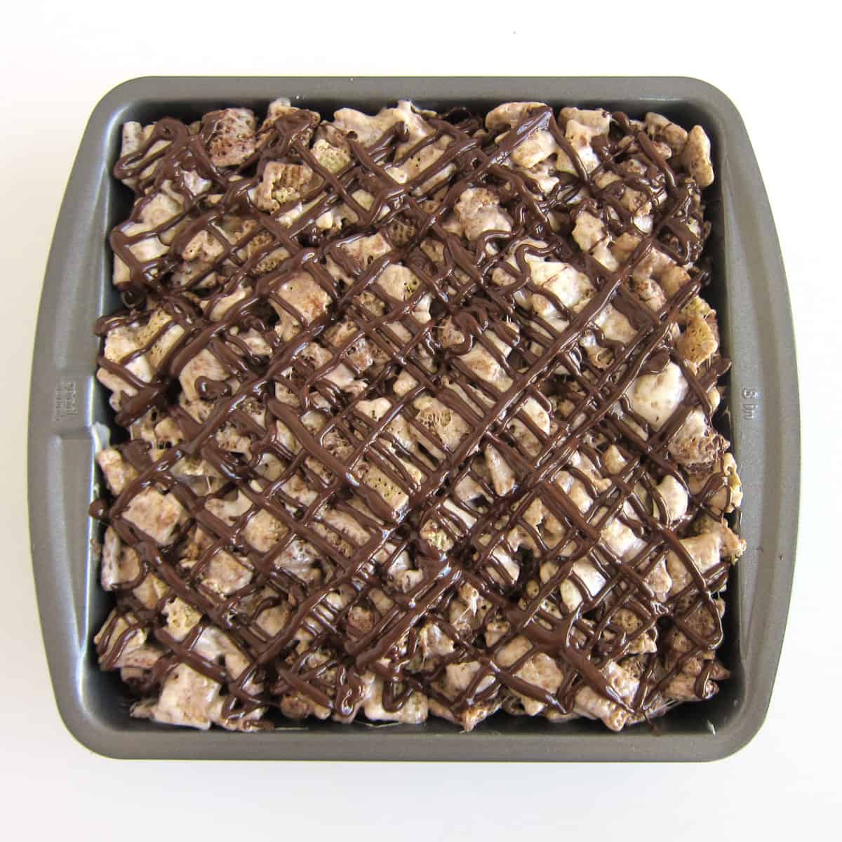 chocolate drizzled over the chex bars in an 8-inch pan