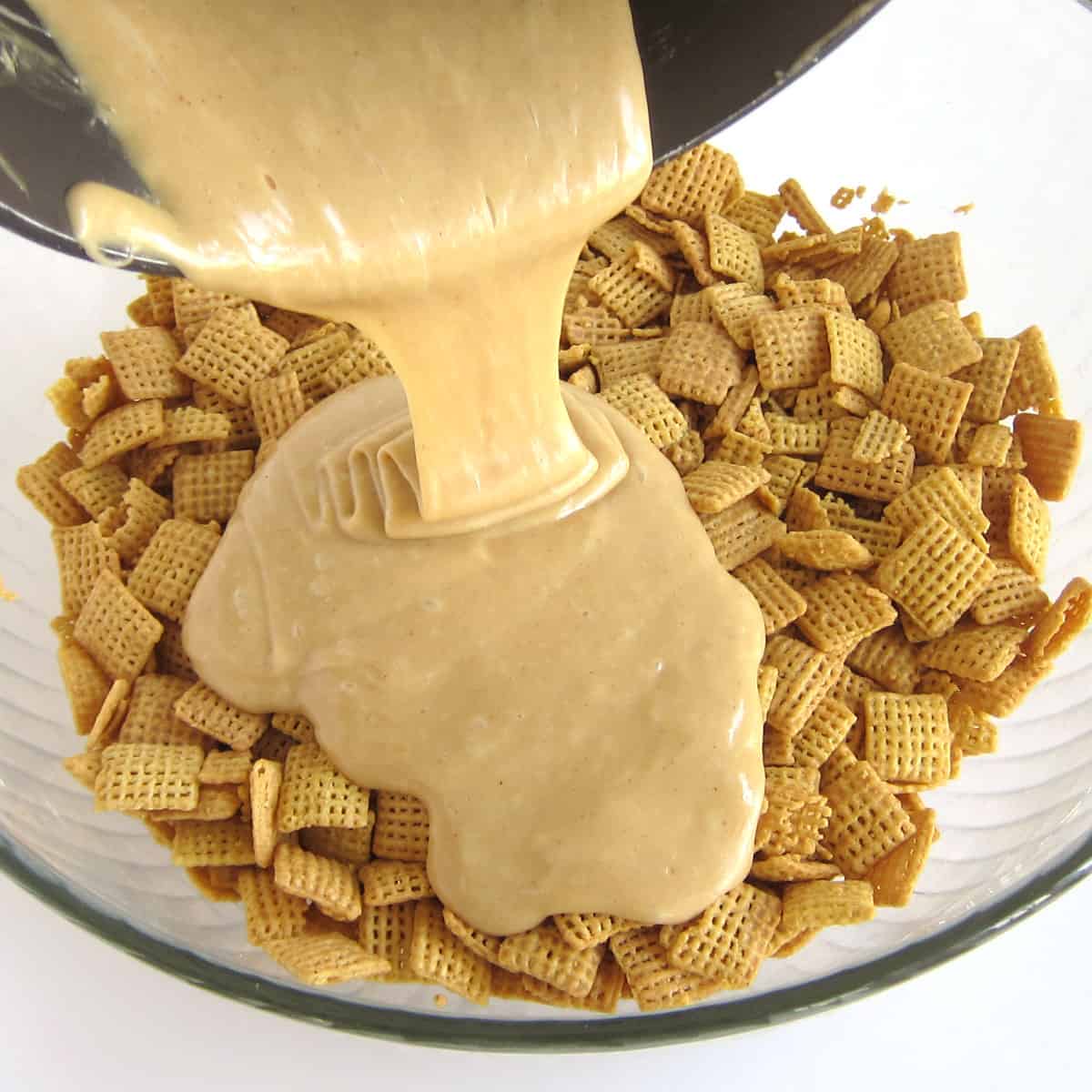pouring melted peanut butter, marshmallows, and butter over peanut butter Chex cereal.