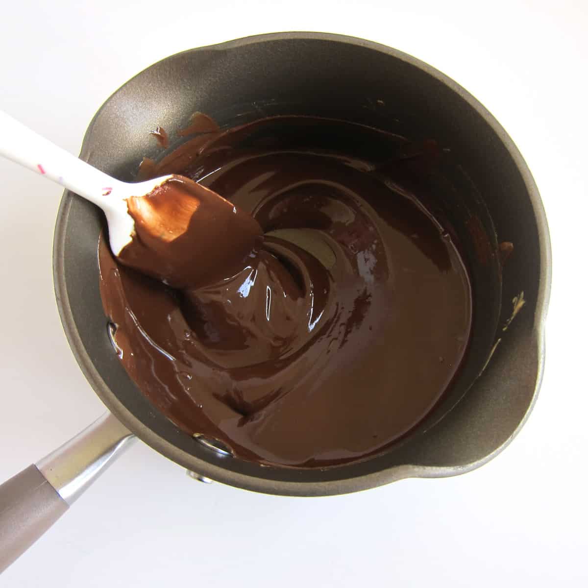 stirring melted chocolate and peanut butter