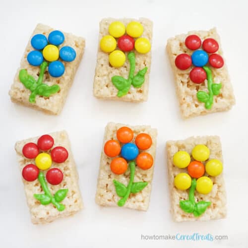 colorful candy flowers with icing on cereal treats