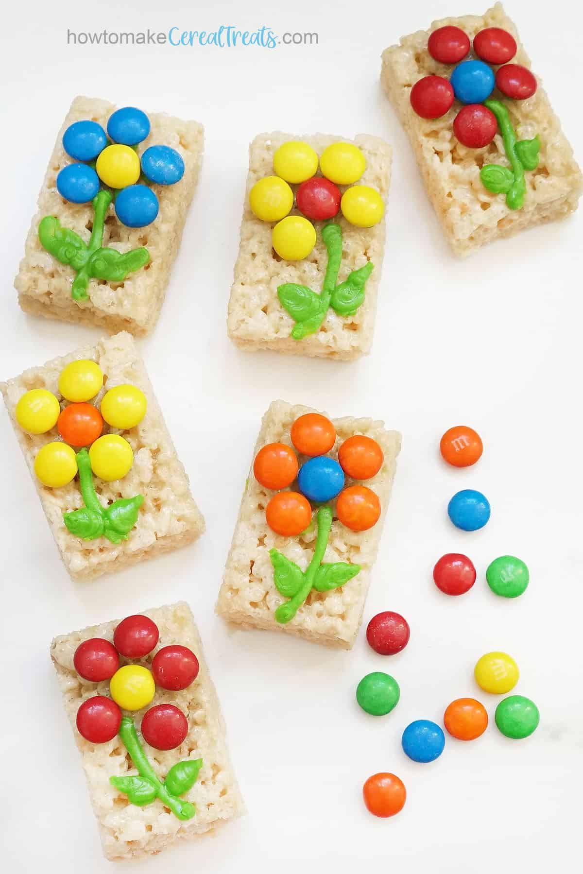 M and M candy flowers and icing on spring Rice Krispie Treats 