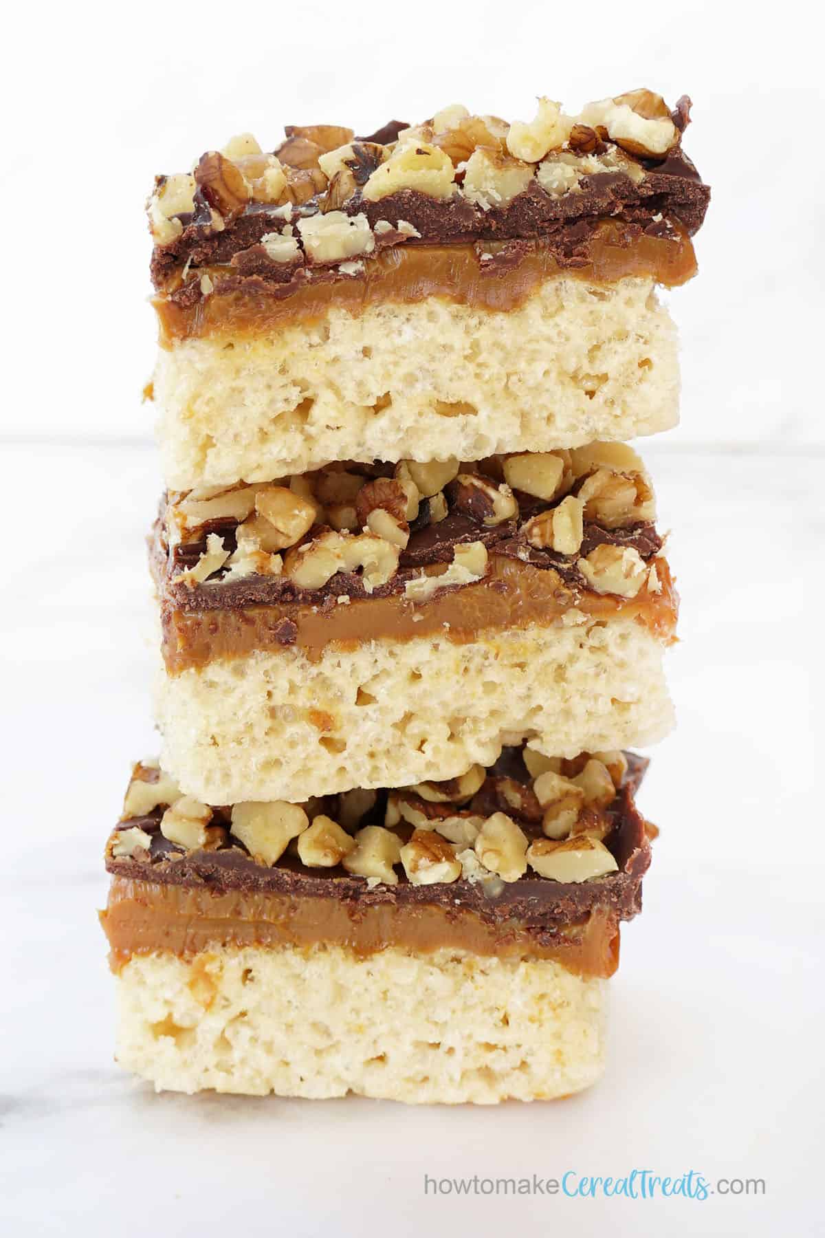 stacked turtle rice krispie treats with nuts 