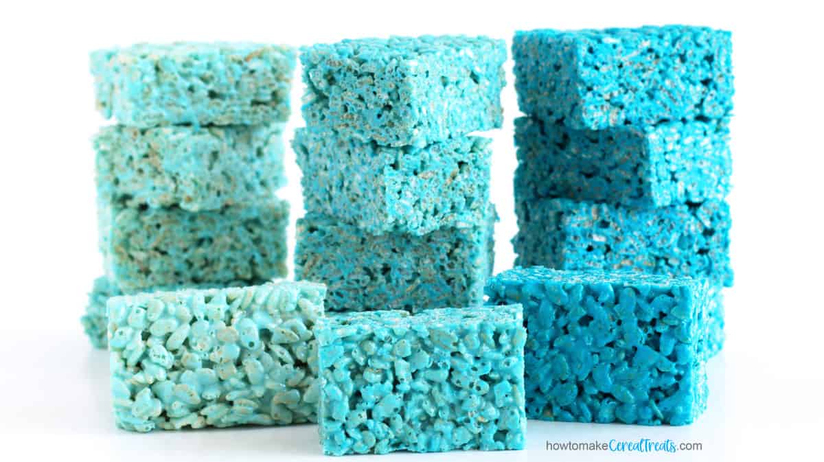 light blue, medium blue, and royal blue rice crispy treats stacked next to each other
