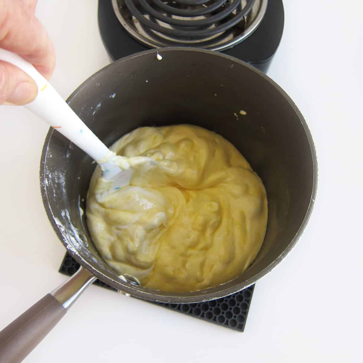 stirring melted banana pudding marshmallows