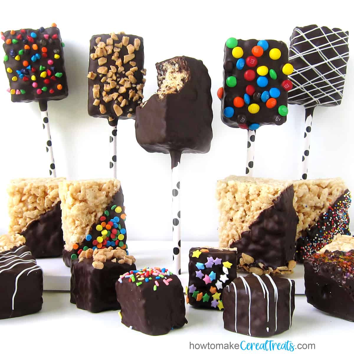 Chocolate-dipped rice krispie treats on a stick.