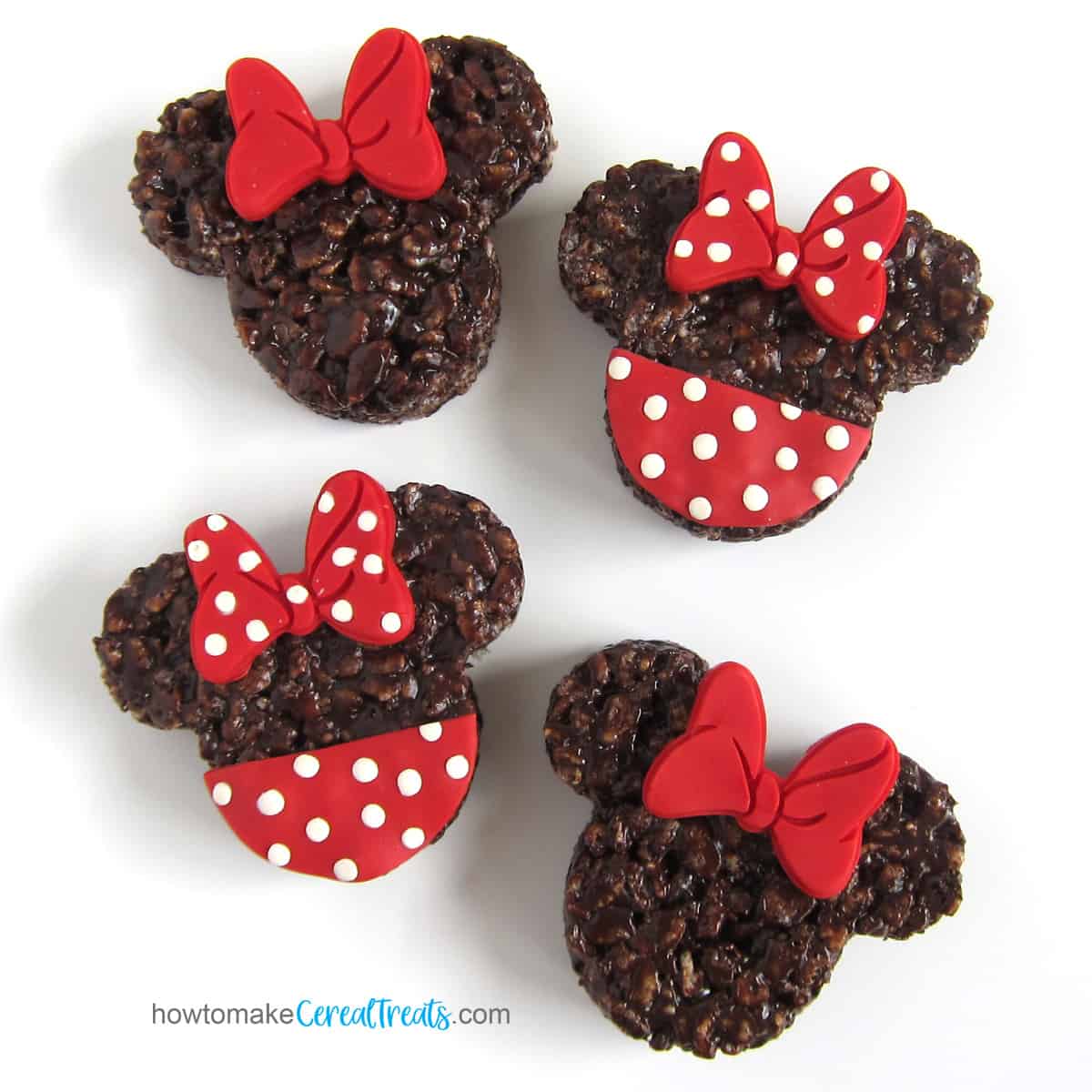 Minnie Mouse Rice Krispie Treats with red bows and red and white polka dot bows and "dresses"