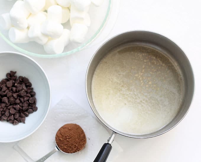saucepan with melted butter, marshmallows, and chocolate 