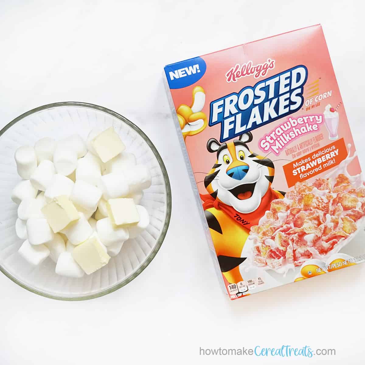 box of strawberry frosted flakes and bowl with butter and marshmallows