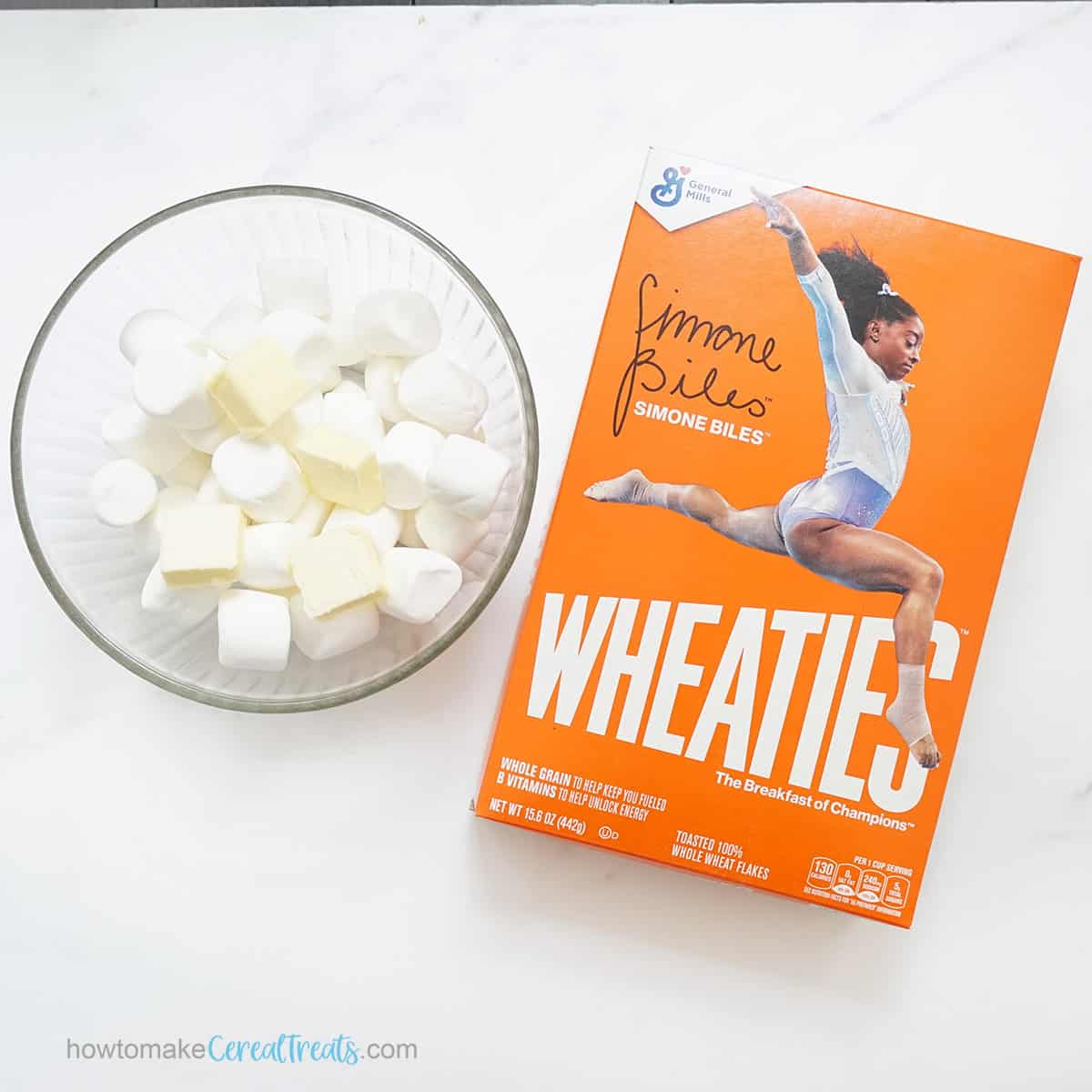 bowl of marshmallows and butter and box of Wheaties cereal