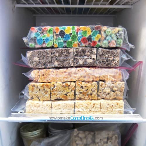 Bags of assorted Rice Krispie Treats and cereal treats stacked on a freezer shelf.