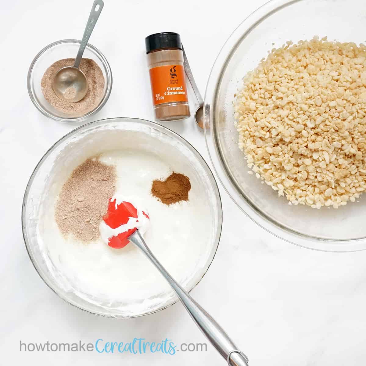 adding cinnamon sugar to marshmallows and Rice krispie cereal
