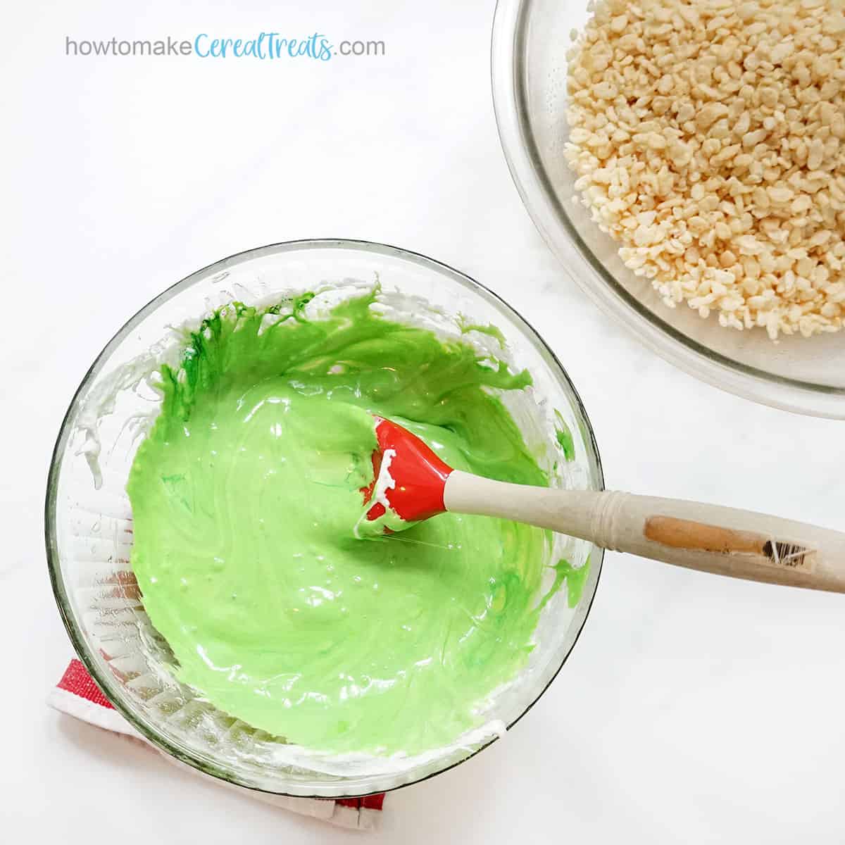 Rice Krispies and bowl with marshmallow butter mixture tinted green